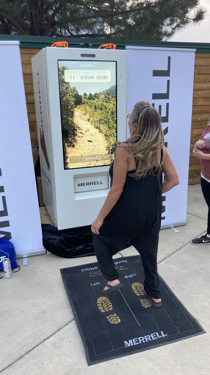 Attendee on foot pads during Merrell speed challenge trail activation